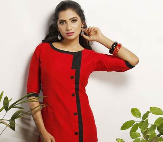 Ajio's ‘The Tasseled Tale Women's Collection’ girl in red kurti with black buttons